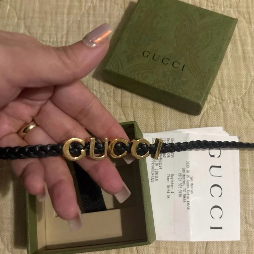 Gucci Black and Gold Logo double strap bracelet .